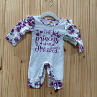 GIRLS THE PRINCESS HAS ARRIVES WHITE/PURPLE FLORAL ROMPER 60